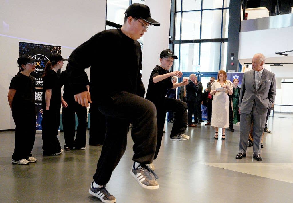 Charles III watching a dance performance during his W5 Life visit