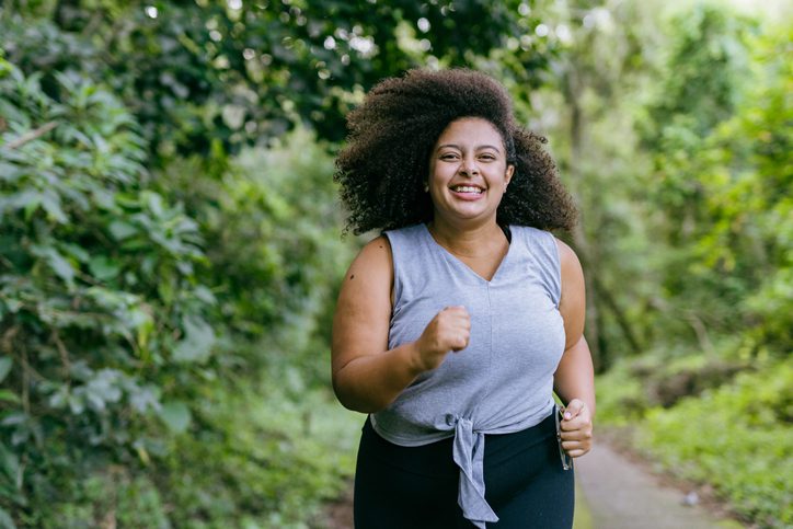 woman running in a natural park
