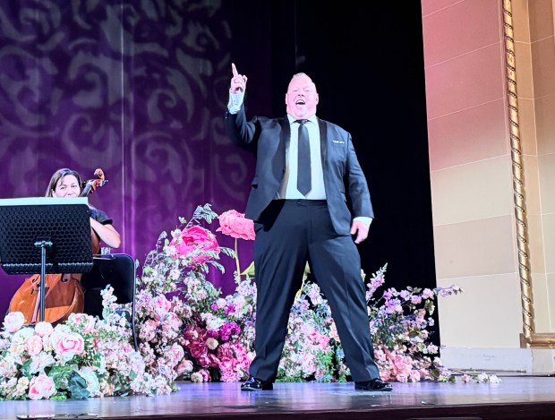 Tenor Ben Gulley holds a notebook during the San Jose Symphony Orchestra's