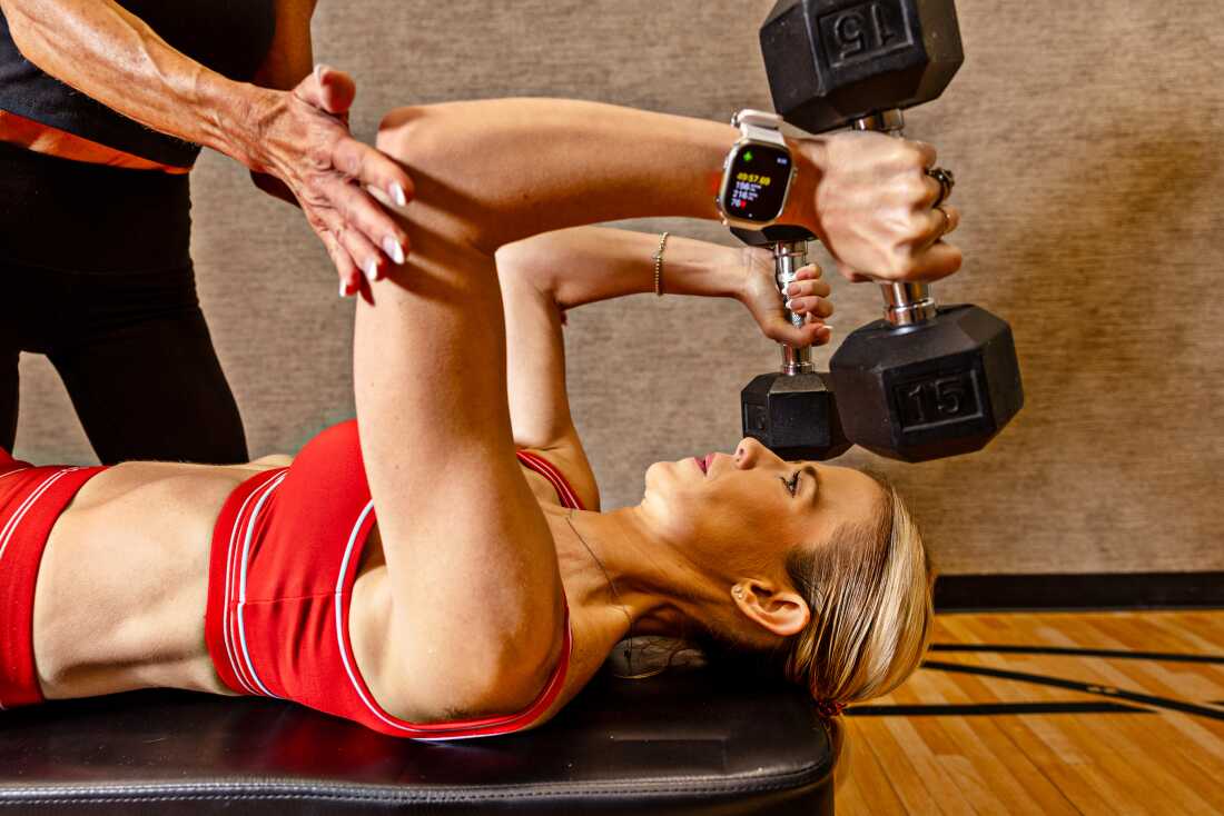 Elizabeth Smart lifts weights at her home gym with bodybuilding coach and friend Robin Maher on Friday, May 15, 2026, in Midway, Utah. Smart has publicly revealed that he competes in the sport of bodybuilding. This is because she continues to be an advocate for women and victims of sexual violence, even after she was kidnapped when she was 13 years old. Photo by Kim Ruff, NPR