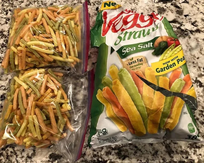 Two bags of veggie straw snacks and an open empty veggie straw bag on the kitchen counter