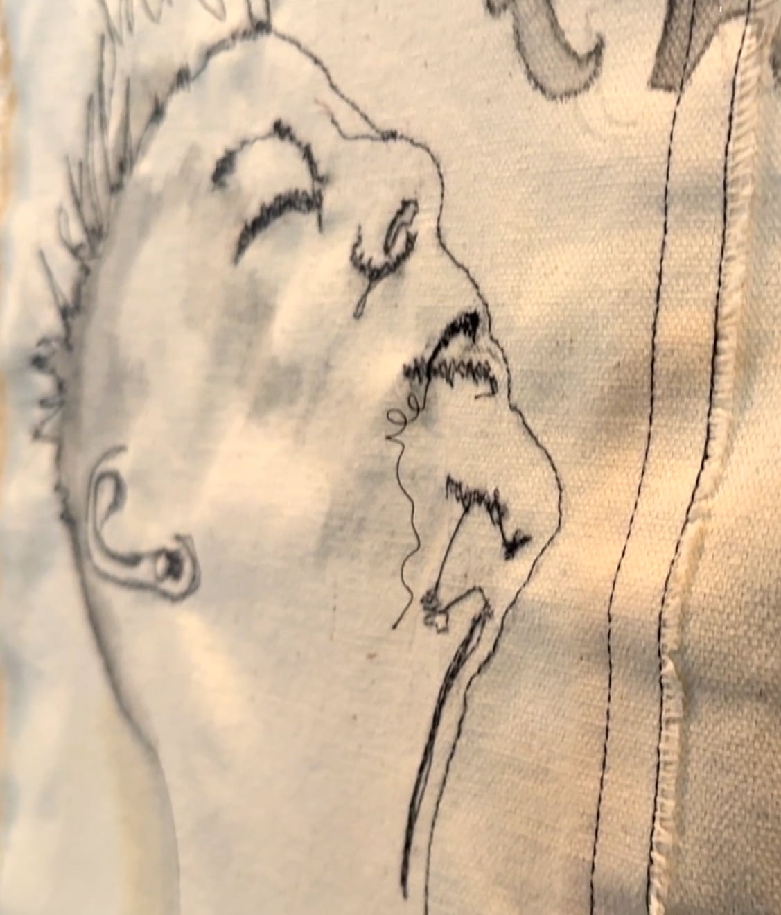 Stitched face of a woman staring at the sky with her eyes closed