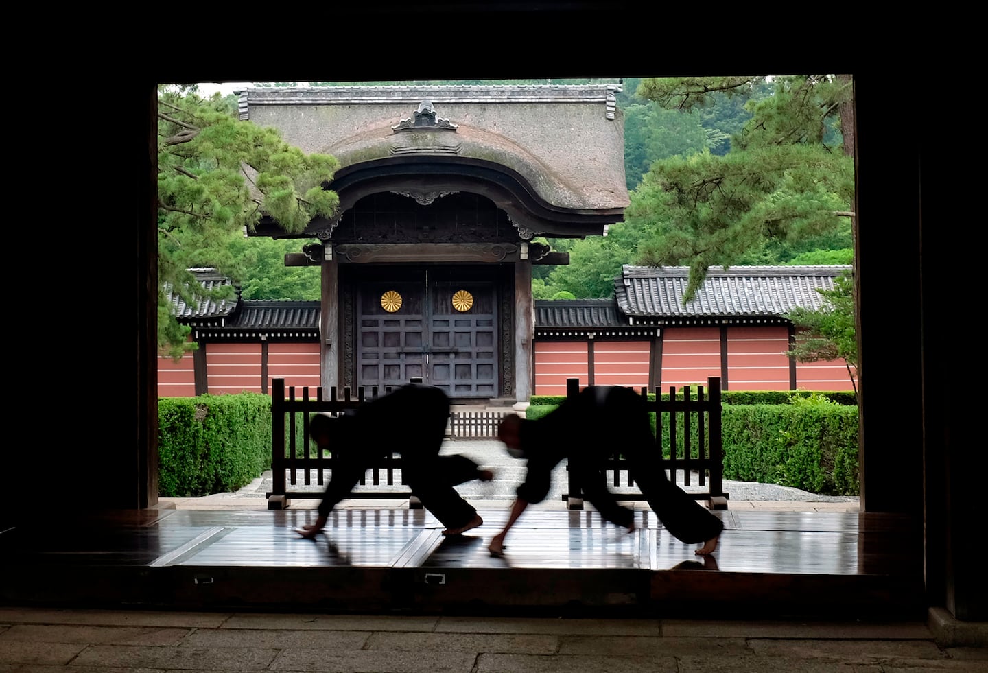 Monks polished the wooden corridor of the walkway that connects between temple buildings at Soji-ji in Yokohama, Japan.